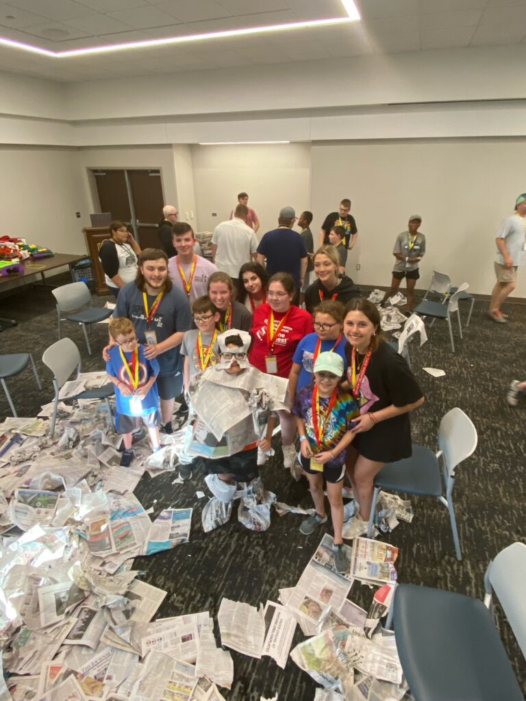 Campers posing for a group photo on Newspaper night.
