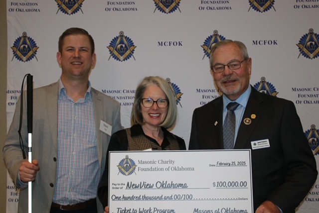 Mark Ivy and Lauren Branch accept a grant check from Masonic Charity Foundation of OKlahoma