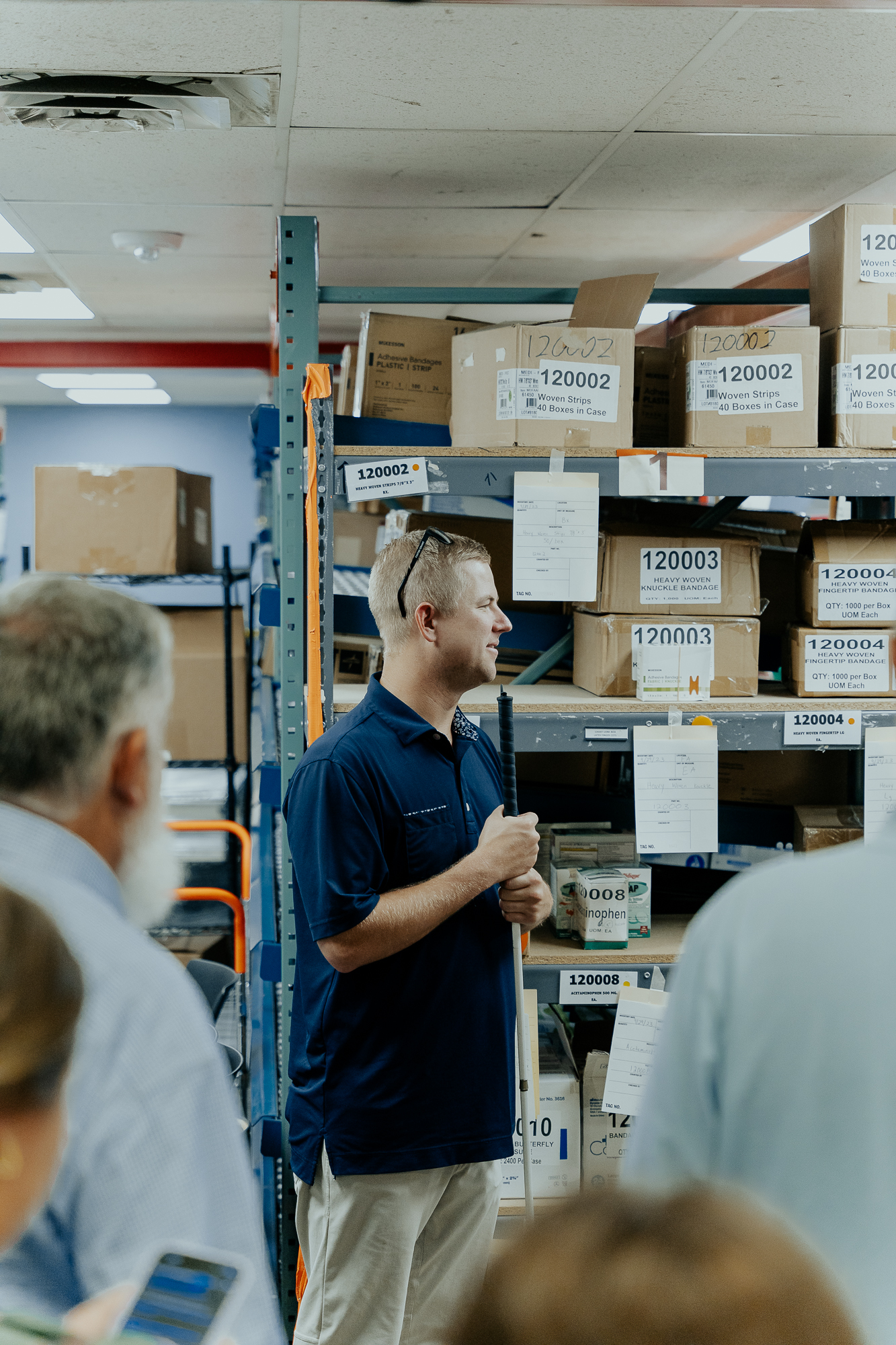 A NewView employee who is blind is seen offering a tour of the manufacturing plant.