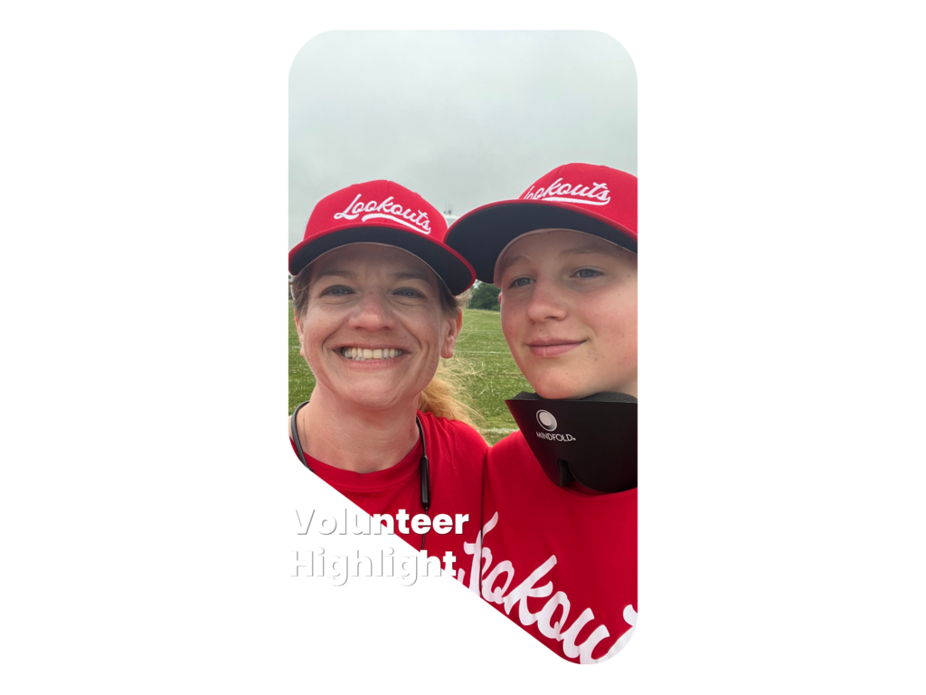 Melissa and her son Gabe standing close together wearing NewView Lookouts uniforms and smiling.