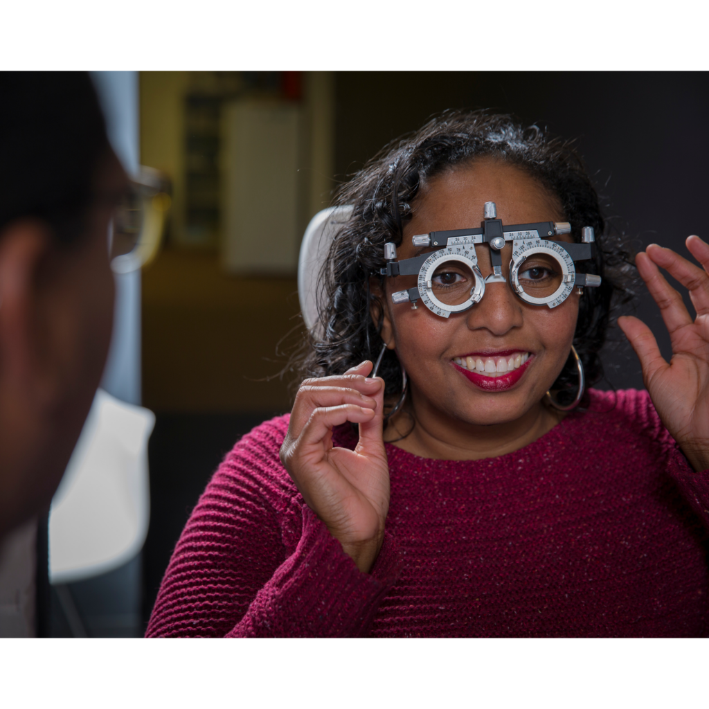 A NVO patient looking through a vision measuring device.