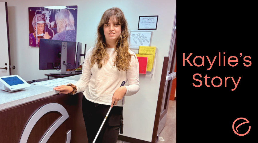 Kaylie standing in front of the reception desk smiling. On the side it reads, "Kaylie's story."