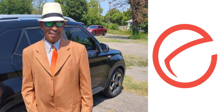 Karl in a fancy suit with NVO logo next to him.