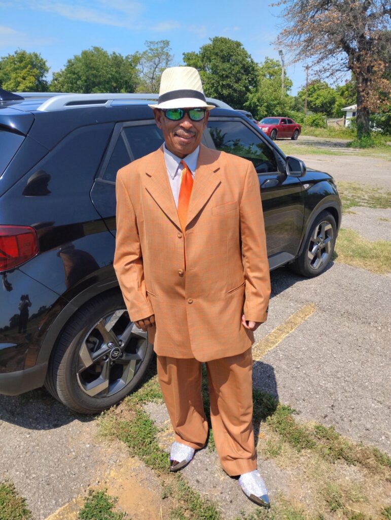 Karl in a fancy suit looking super sharp.