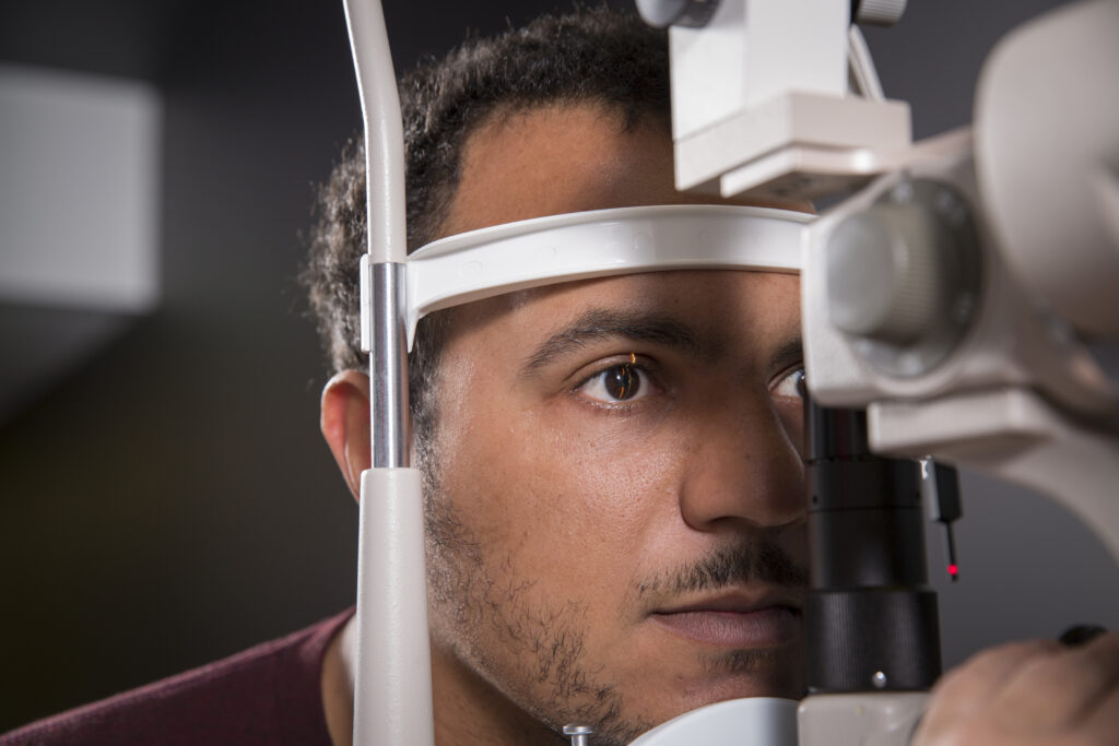 Young man getting vision checked.
