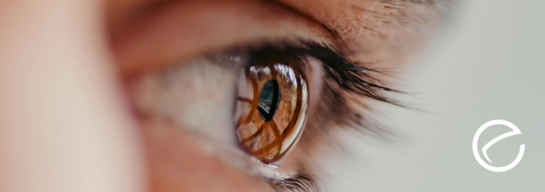 A close-up shot of a brown eye with the NVO logo off to the side.