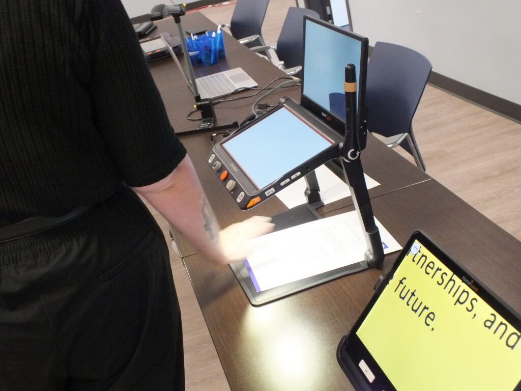 A wide variety of assistive technology displayed on tables during a Keys to Work day.