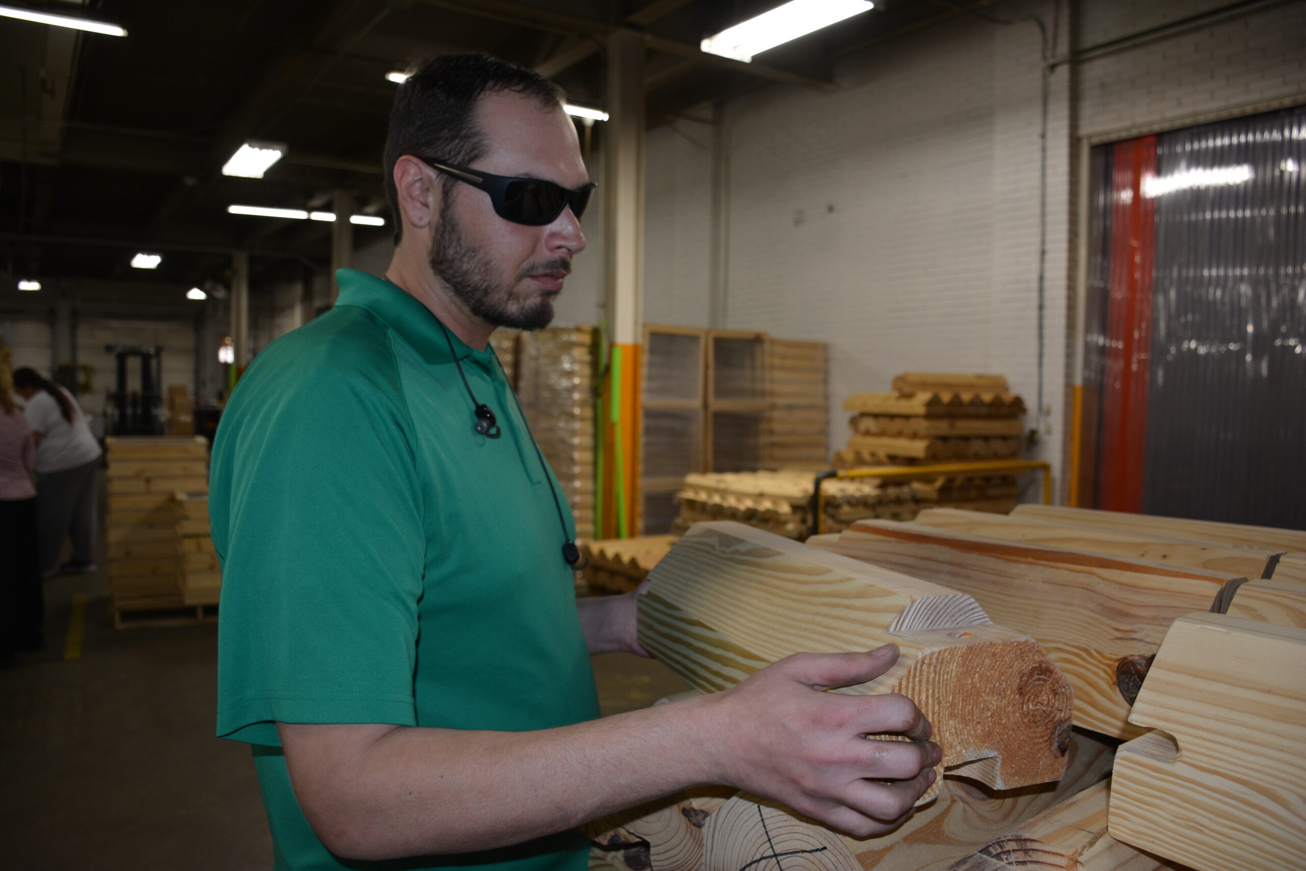 Man with vision loss working in the chock area.